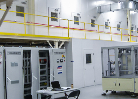 warehouse interior with special enclosure units for battery storage