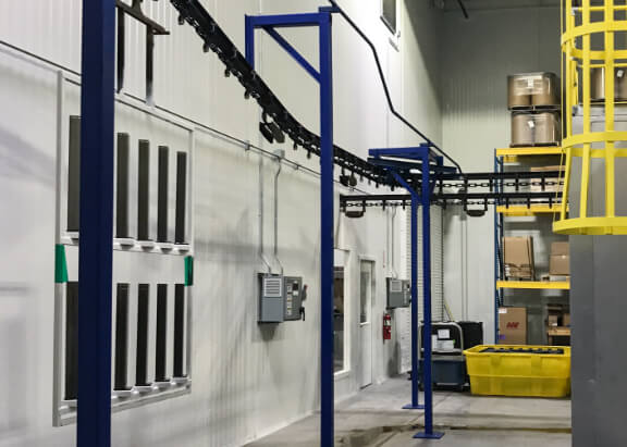 SteelSpan system integrated with conveyors and air circulation equipment in a warehouse setting