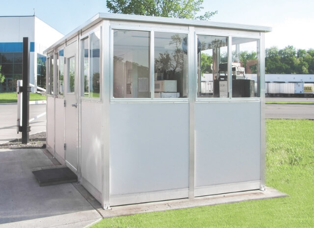 an outdoor prefabricated booth used a a security shed
