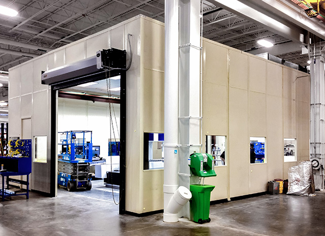 indoor enclosure to both protect delicate machinery from dirt and elements, and protect workers from machine hazards