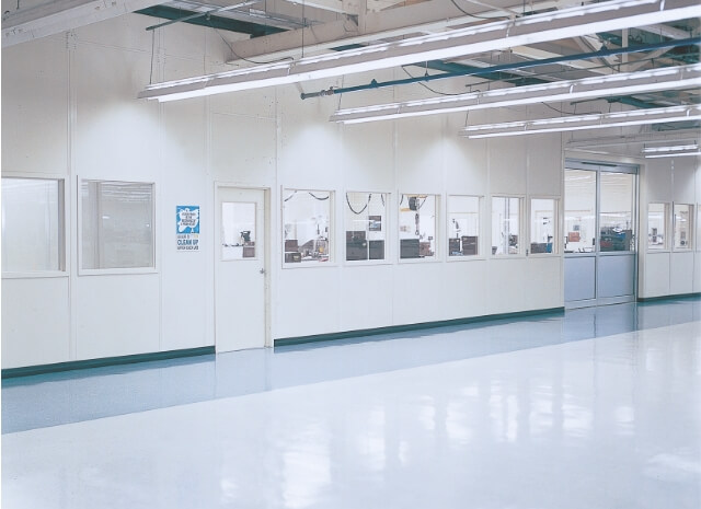 floor to ceiling wall partitions create a separated space on a large warehouse floor